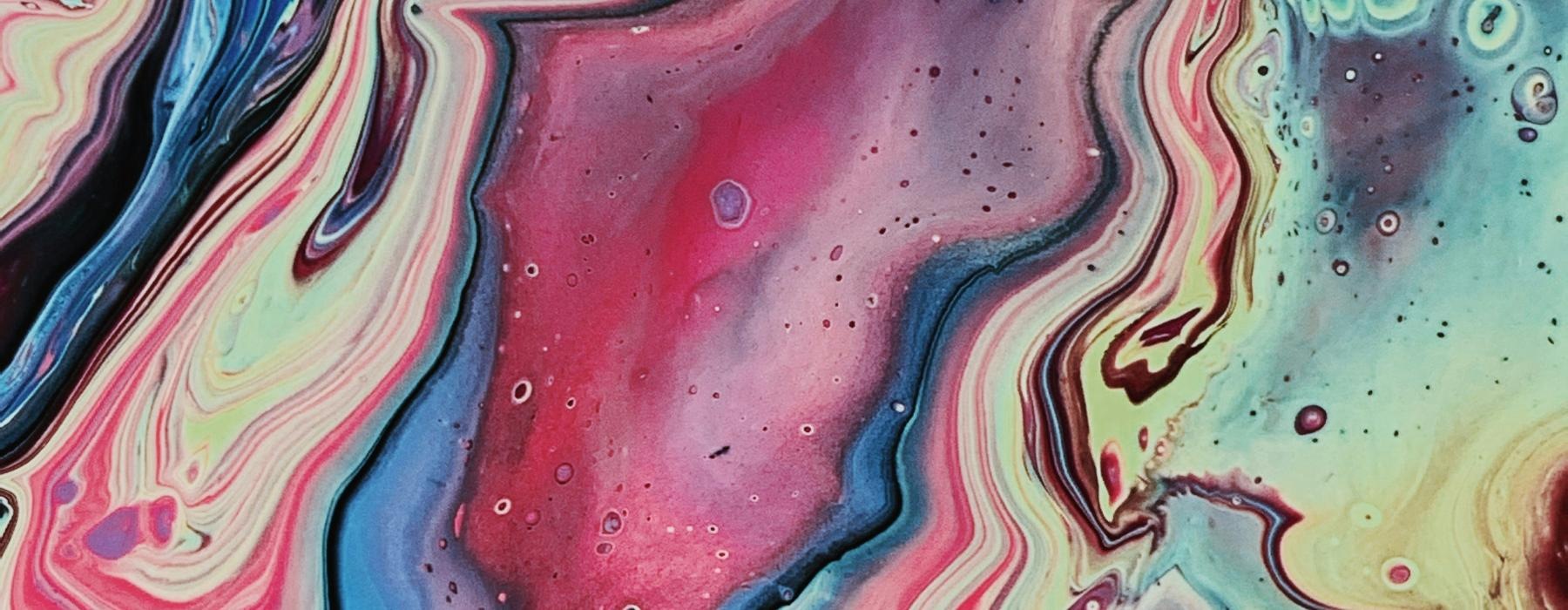 a colorful painting of a wave
