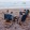 a group of people sitting in chairs on a beach
