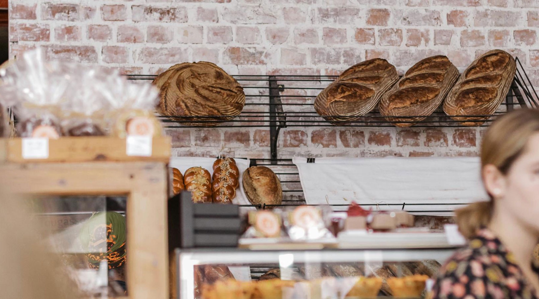 Vibrant community life with a variety of dining options Bread kitchen with loafs of bread and a brick wall